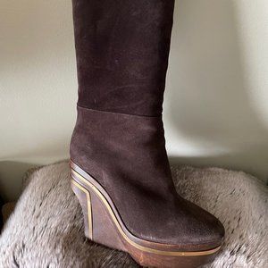 Brown suede boots with wood platform heel and gold hardware accents.